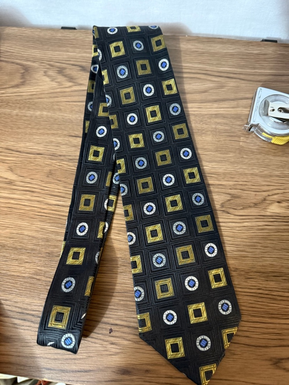 XMI Black Geometric Pattern Men’s Tie with Gold and Blue Accents